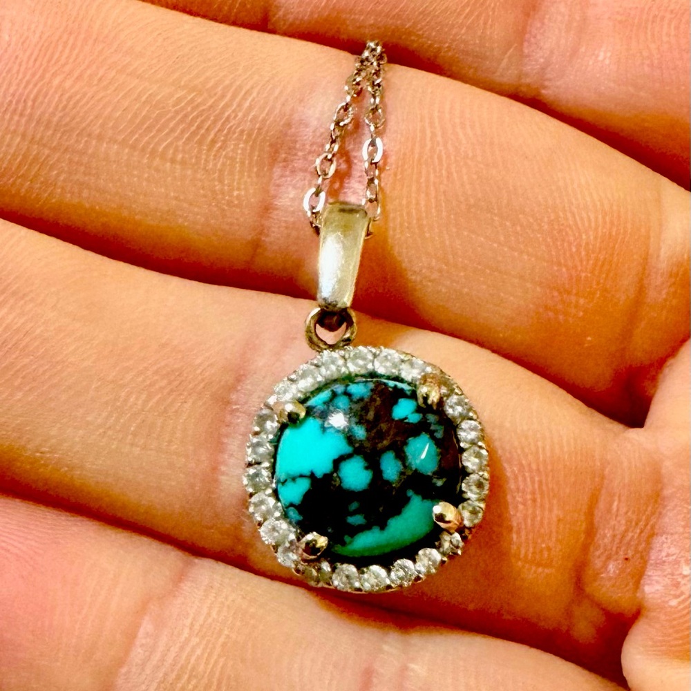 Turquoise pendant surrounded by diamonds. Custom made necklace.
